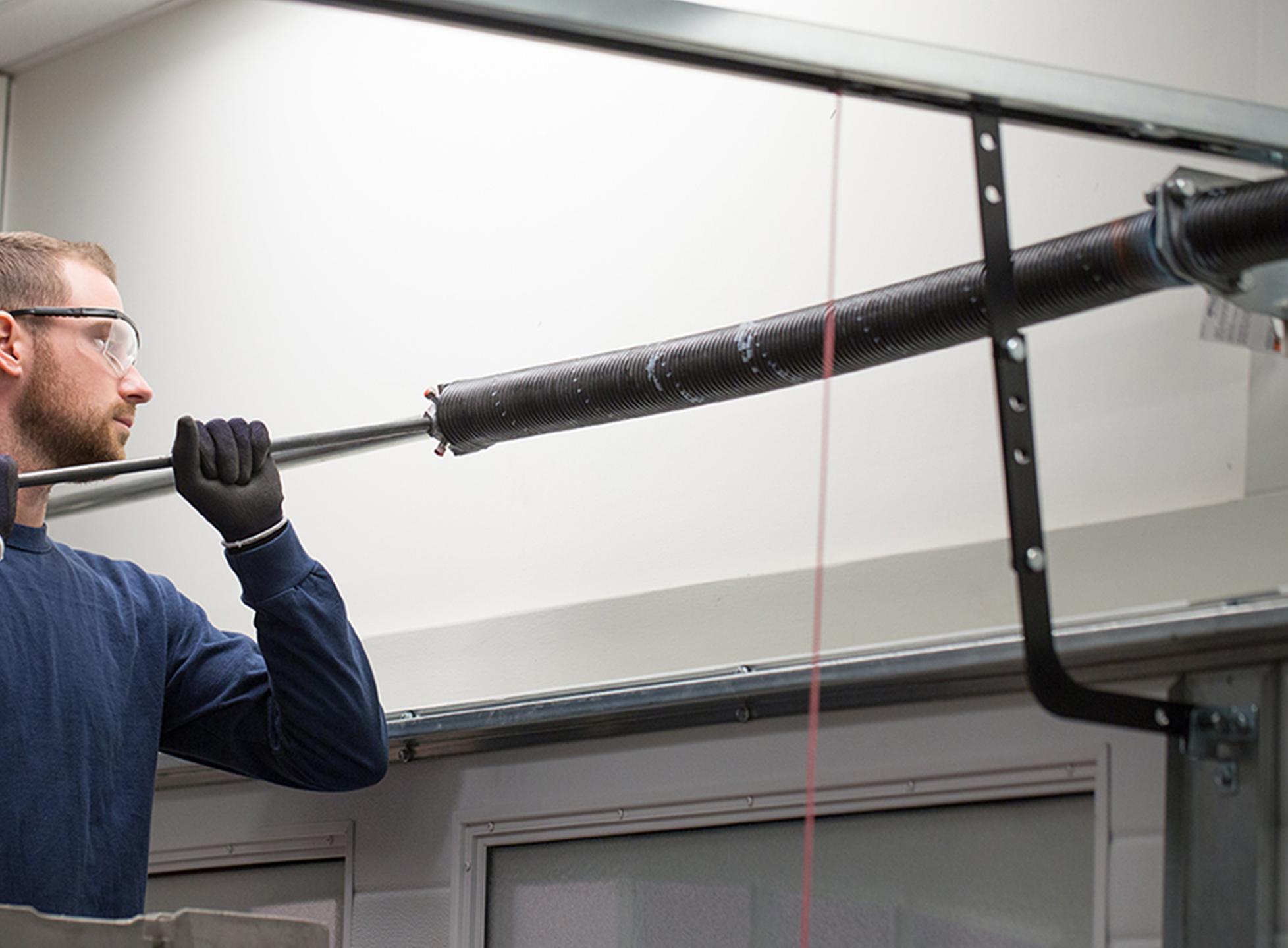 Professional extension spring replacement - AK Garage Door Service
